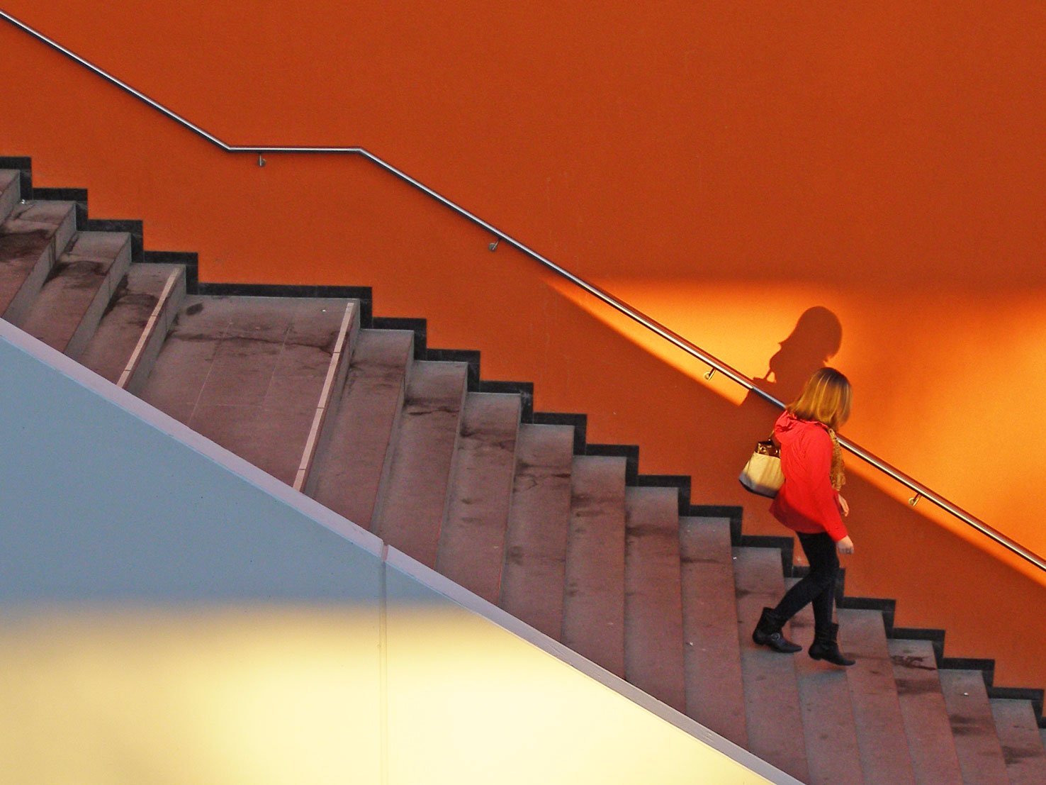 woman walking down stairs