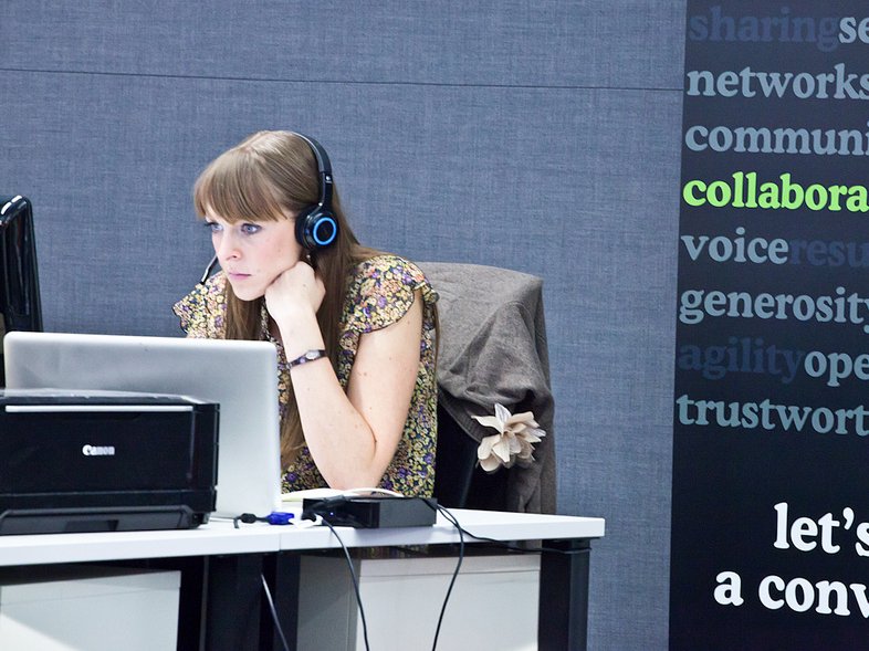 woman working beats headphones computer office job