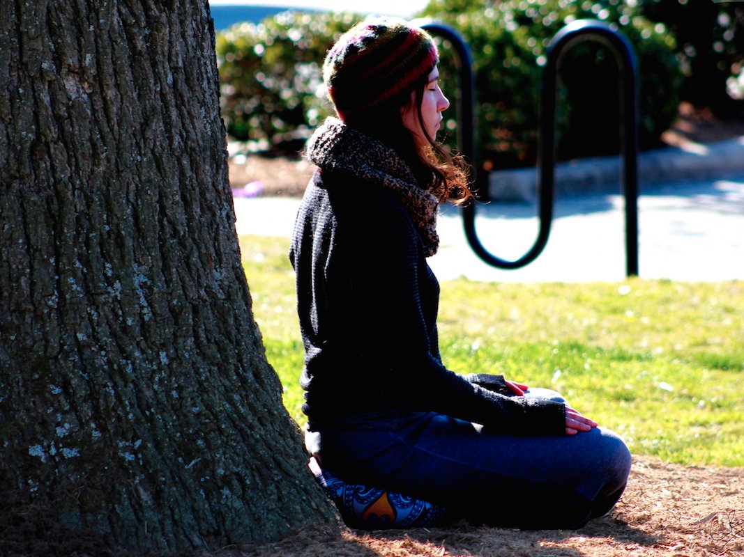 woman meditating outside