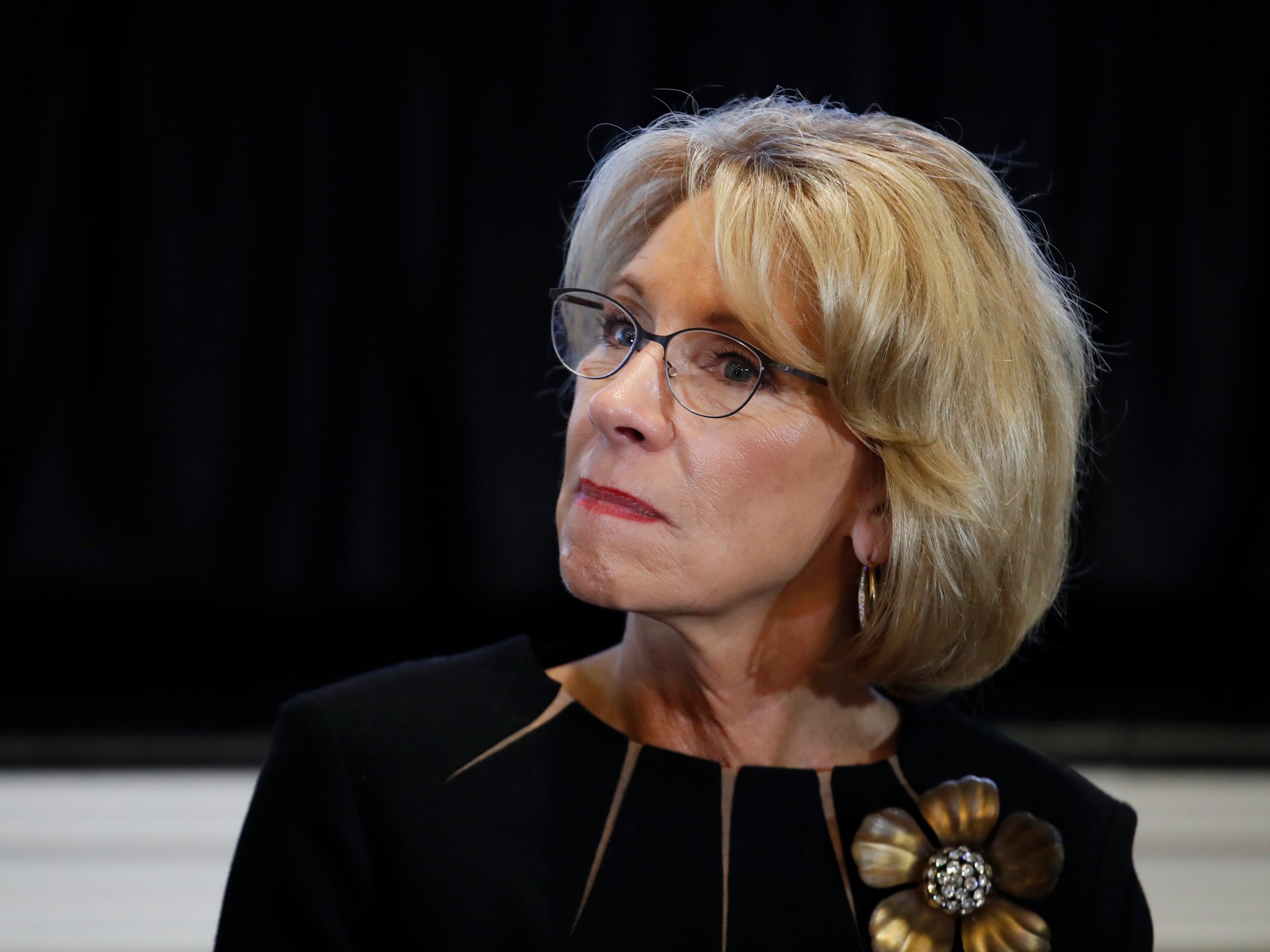 Education Secretary Betsy DeVos, listens to Vice President Mike Pence speak during a listening session with the historically black colleges and universities at the Eisenhower Executive Office Building on the White House complex in Washington, Monday, Feb. 27, 2017.