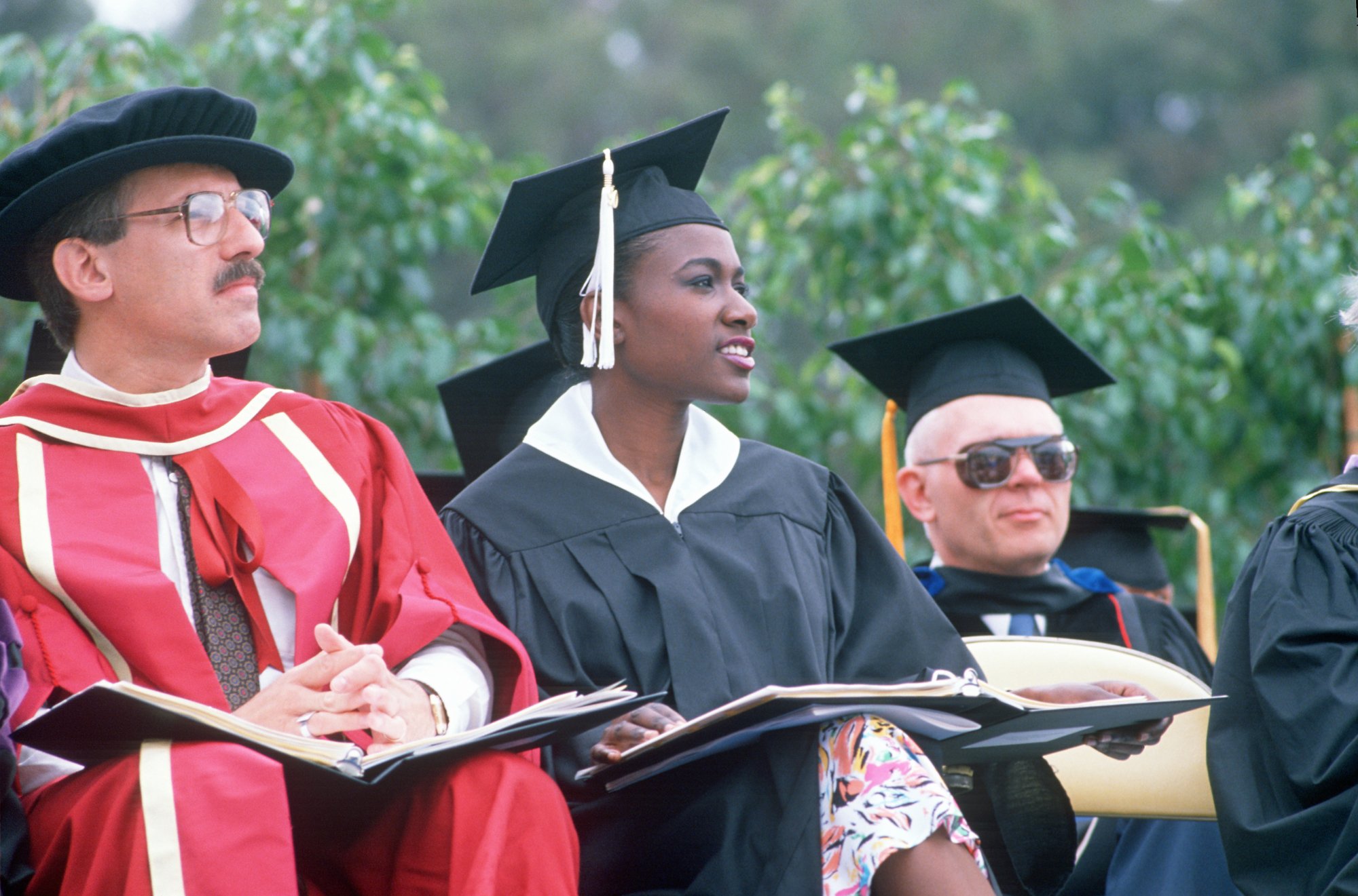 diverse tenured professors graduation ceremony academic dress shutterstock_269108810