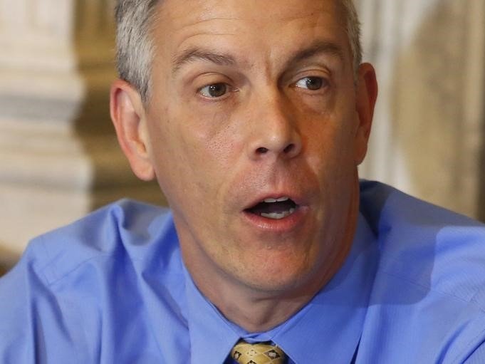 U.S. Secretary of Education Arne Duncan participates in an open meeting of the President's Advisory Council on Financial Capability for Young Americans at the Treasury Department in Washington, October 2, 2014. REUTERS/Yuri Gripas