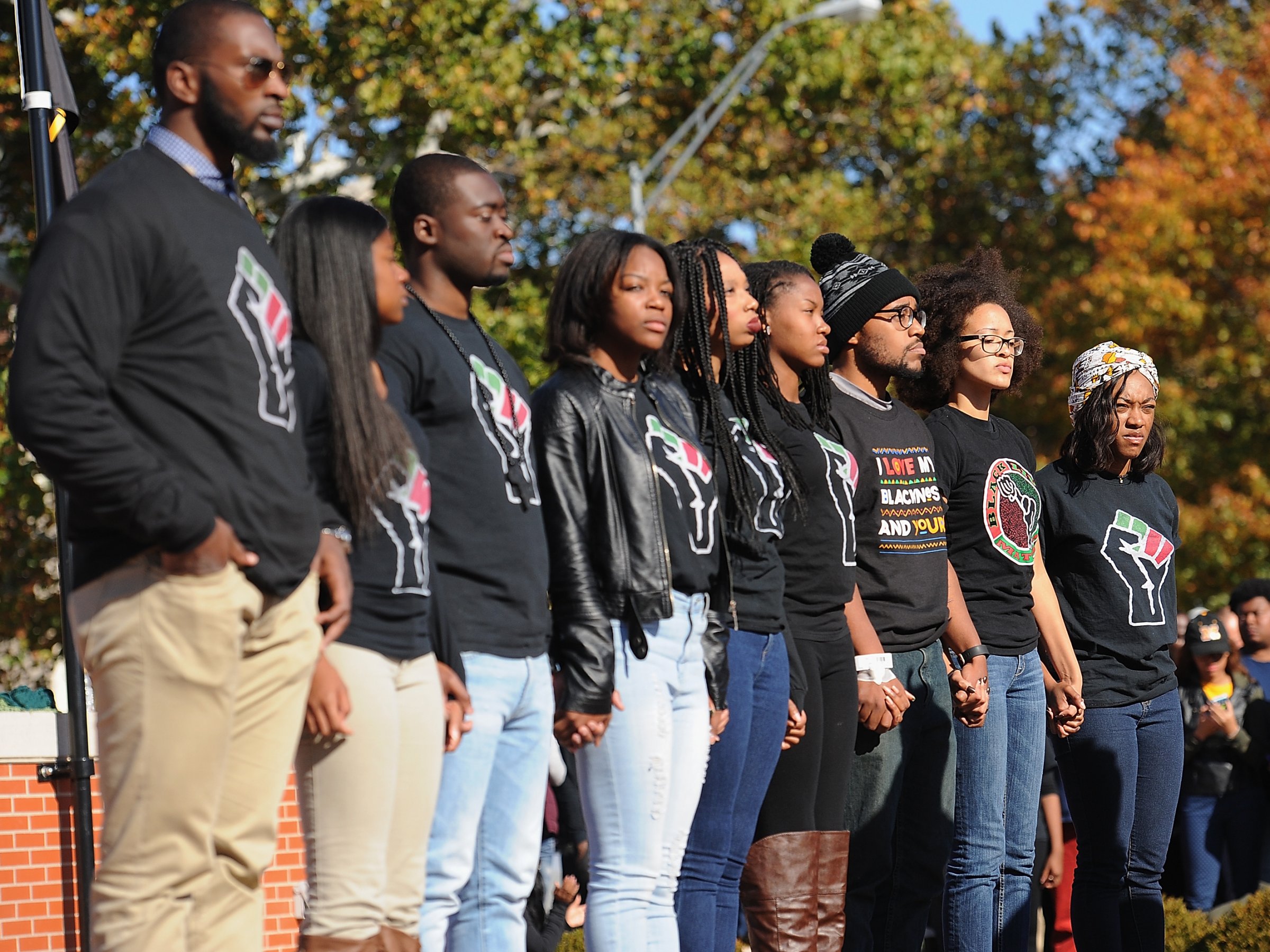 Jonathan Butler (c), a University of Missouri grad student who did a 7 day hunger strike listens along with founding members of the campus group, Concerned Student 1950, during a forum speaking to students on the campus of University of Missouri - Columbia on November 9, 2015 in Columbia, Missouri. Students celebrate the resignation of University of Missouri System President Tim Wolfe amid allegations of racism. (Photo by Michael B. Thomas/Getty Images)