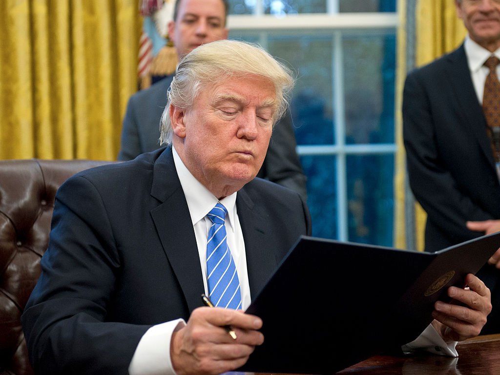 Donald Trump reading bill