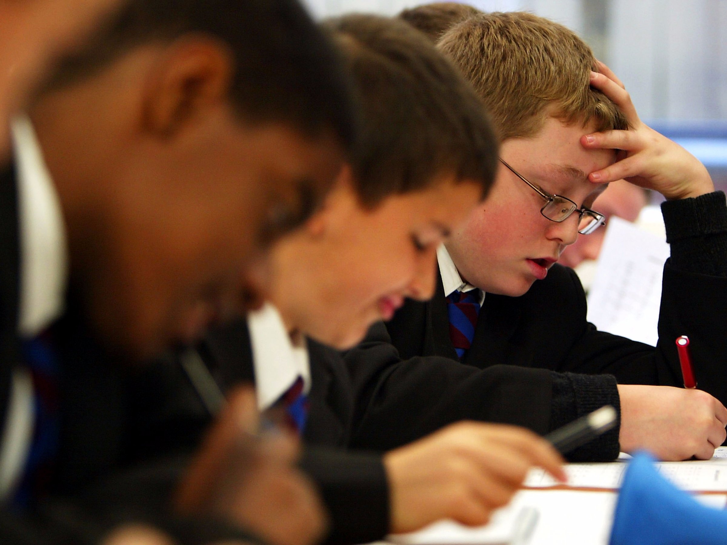 tudents work during a lesson at The Cardinal Vaughan Memorial School on September 4, 2003 in London. Students across the United Kingdom are returning to school for the start of the 2003/4 academic year.